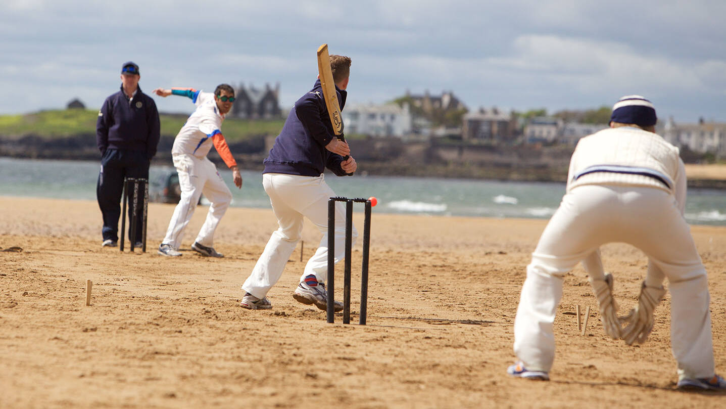 Cricket being played on the beach outside The Ship Inn, Elie, Fife