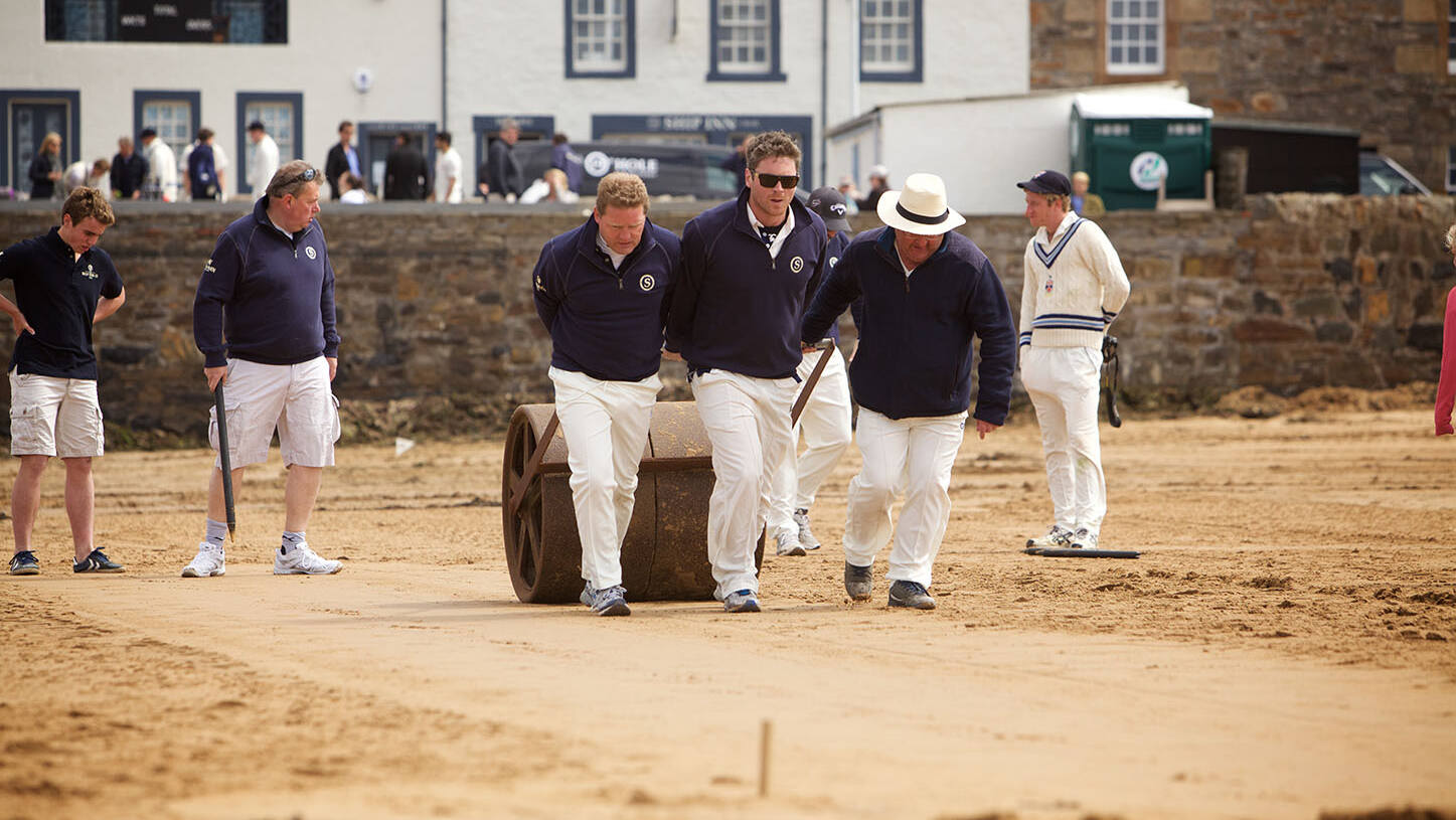 Cricket pitch being prepared on the beach in front of the Ship Inn, Elie
